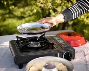 OMNIA Kit 1 set with Camp Oven, Silicone Mold, Potholders, Baking Grid, and Storage Bag for outdoor cooking